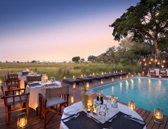 Viagem Botsuana-Nxabega-Okavango-Tented-Camp-Guest-Area-Romantic-jantar na piscina